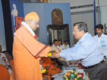 0029 0022 Srimat Swami Vishwatmanandaji Maharaj, Belur Math is being garlanded by Dr N Vinay Hegde